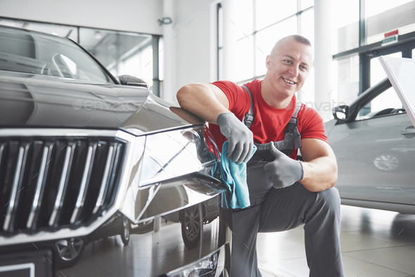 Professional cleaning and car wash in the car showroom Stock Photo by ...