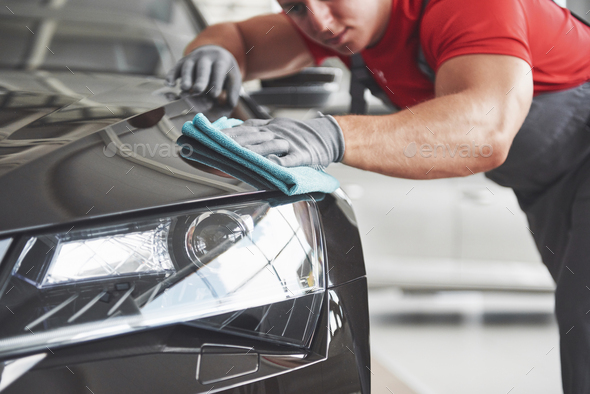 Professional cleaning and car wash in the car showroom - Stock Photo - Images