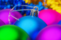 Bright Blue Christmas Ball in Selective Soft Focus in Foreground, Surrounded Blurry Colorful Balls - PhotoDune Item for Sale