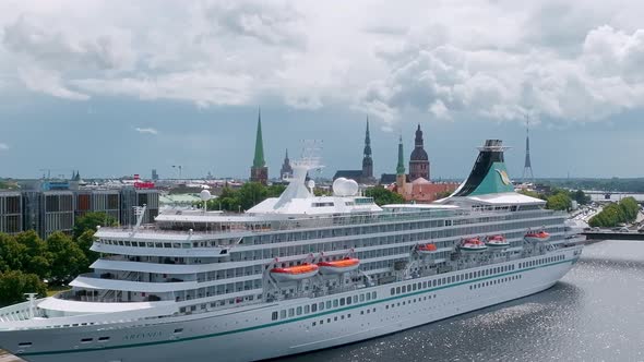 Beautiful Cruise Ship Docked in Riga Latvia Near the Old Town and the Bridge alt