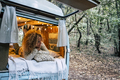 Happy free beautiful woman lay down and relax inside van - PhotoDune Item for Sale