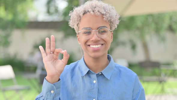 Portrait of Young African Woman Showing Okay Sign OK alt