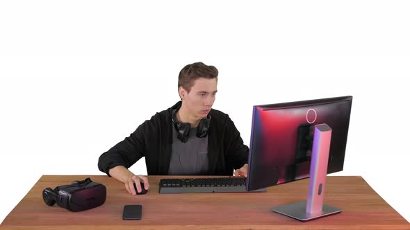 Gamer Playing a Video Game on Personal Computer on White Background. alt