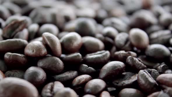 Coffee beans close up shot. Arabica roasted seed food. Black dark coffee beans. Brazilian ingredient alt