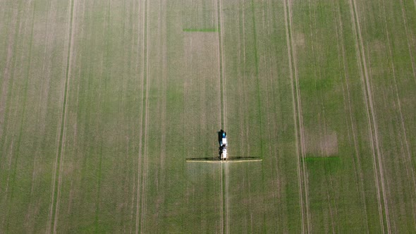 Processing of Agricultural Fields with Fertilizers and Pesticides From Weeds and Pests