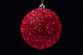 Close-Up View of Shiny Bright Red Christmas Ball Hanging on Black Background - PhotoDune Item for Sale