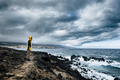 man with yellow jacket in a wild place on the ocean coast - PhotoDune Item for Sale