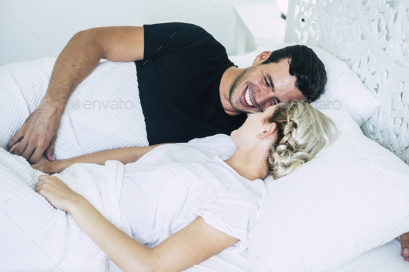 Non-Professional couple on the bed