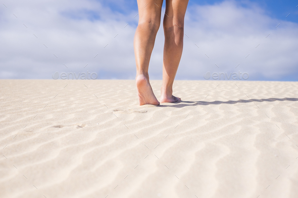 Back view of smooth woman legs and feet walking Stock Photo