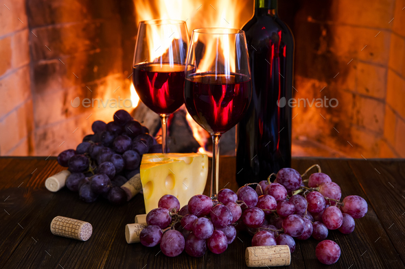 Two mulled wine glasses by the fireplace, christmas time Stock