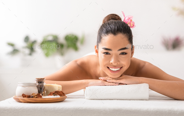 Beautiful Asian Lady Enjoying Beauty Treatments With Natural Cosmetics At Spa