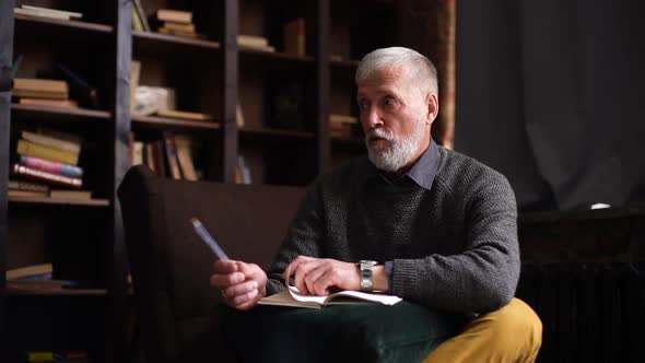 Bearded Mature Psychologist with Gray-hair Is Supporting and Consoling Depressed Patient alt