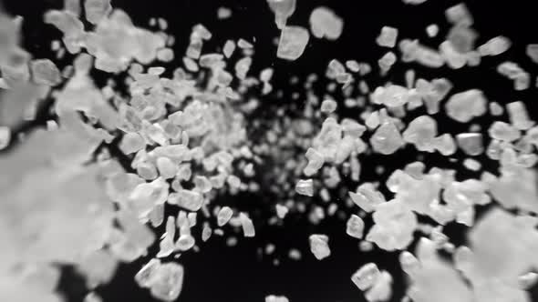 Super Slow Motion Detail Shot of Salt Flying Towards Camera at 1000Fps alt
