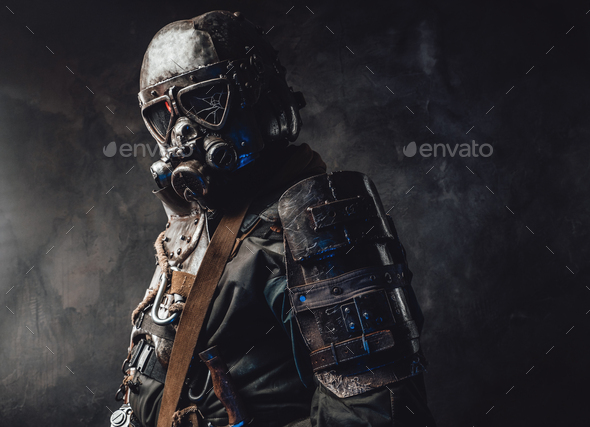 Survivor dressed in custom dark armour and gas mask