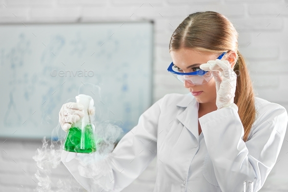 Female chemist working at the laboratory - Stock Photo - Images