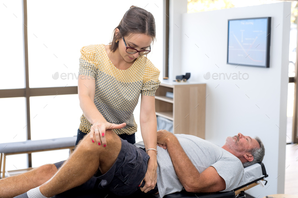 Senior man having chiropractic adjustment