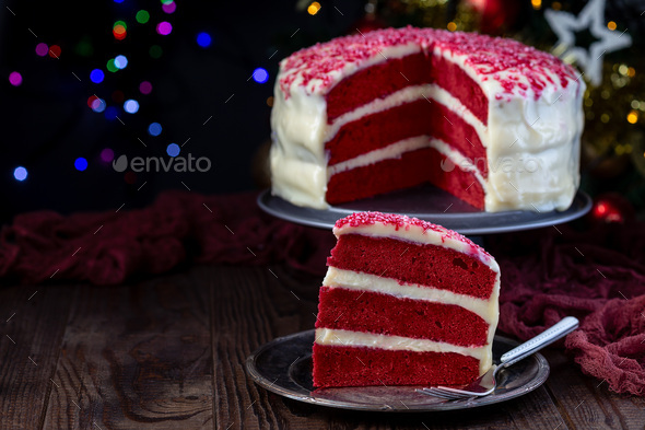 Piece of red velvet cake with cream cheese frosting - Stock Photo - Images