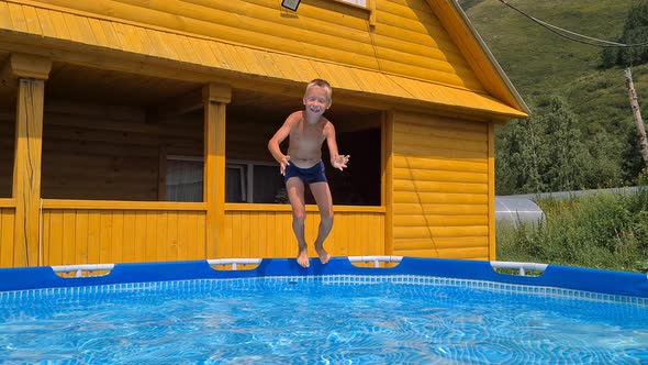 the boy is playing in the home pool