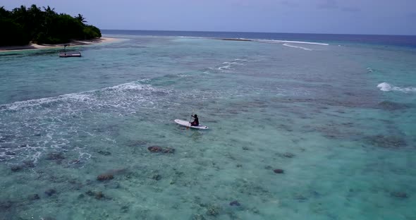 Wide angle aerial copy space shot of a sunshine white sandy paradise beach and aqua blue water backg alt
