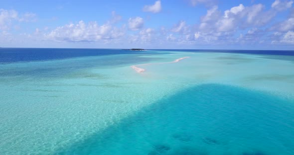 Wide angle above abstract view of a white sand paradise beach and aqua turquoise water background in alt