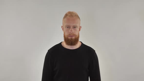 Red-haired Bearded Man Sneezes alt