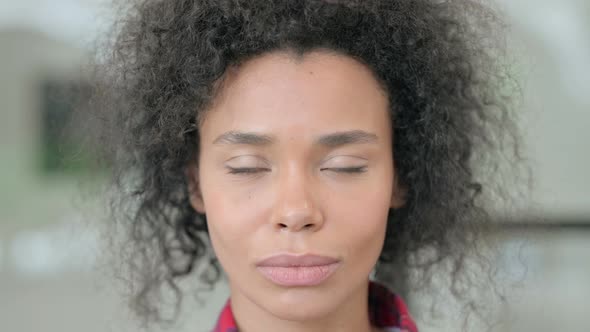 Close Up of African Woman Looking at the Camera alt