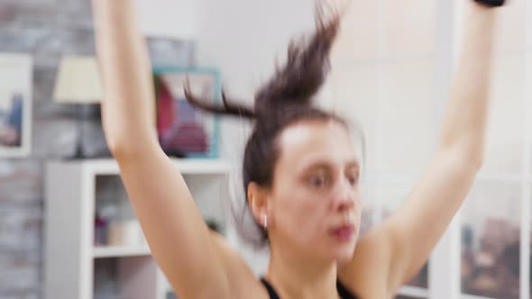 Brunette Girl Warming Up Before the Workout alt
