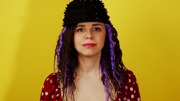 Young Handsome Woman in Black Cap Nodding Head with Approval alt