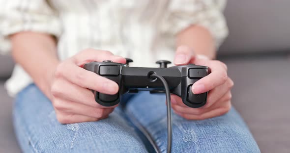 Close up Woman play video game alt
