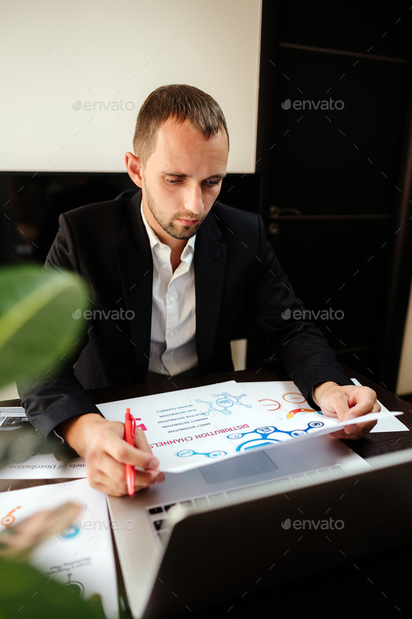 marketing product manager holding marketing promotion plan marketing product manager desk.