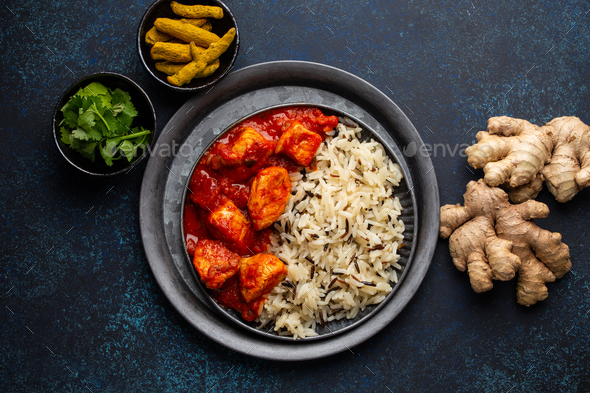 Chicken tikka masala dish with rice - Stock Photo - Images