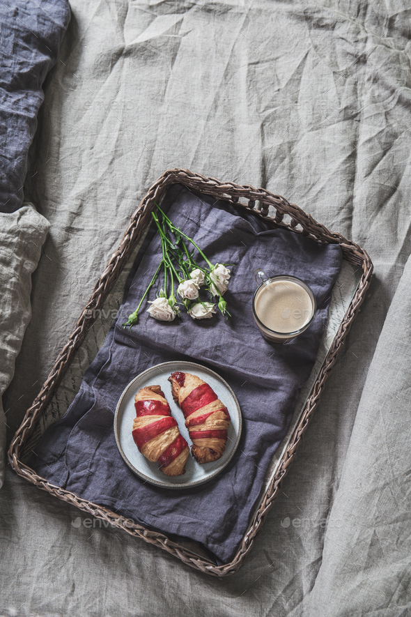 Breakfast Tray On A Bed Croissant And Coffee On Bamboo Tray On Linen Bedclothes Stock Photo By Lblinova