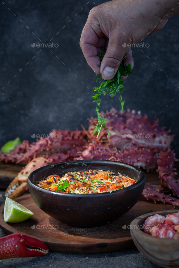 Baked crabmeat crab meat with cheese, cream and bread. Pastel o chupe de sentolla or king crab - Stock Photo - Images