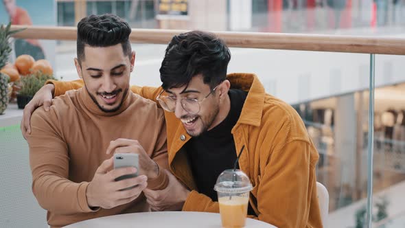 Young Happy Surprised Guy Looks at Phone Screen Checks Email Reads Good News Win Notice Won Lottery alt