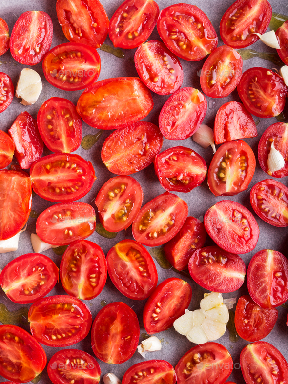 Red heirloom tomatoes with olive oil Stock Photo by tenkende PhotoDune