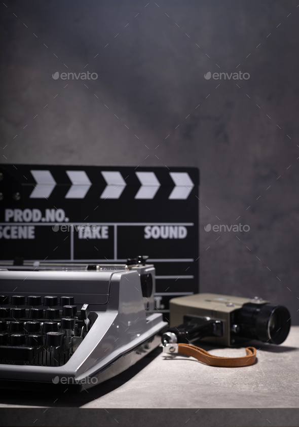 vintage retro typewriter, film camera and movie clapper board Stock Photo by seregam