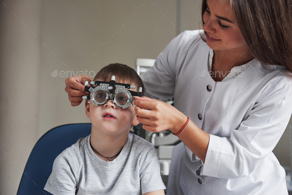 Working in process. Child sitting in the doctor's cabinet and have tested his visual acuity