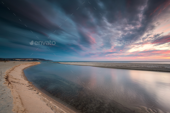 Sea sunrise at a sandy beach - Stock Photo - Images