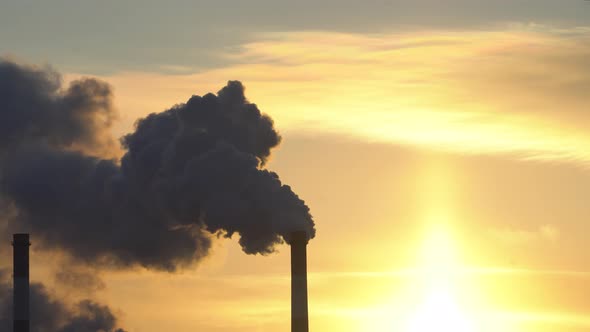 Emission to atmosphere from industry pipes. Smokestack pipes in industrial zone alt