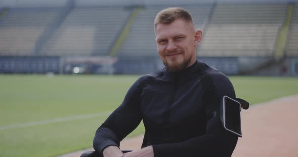 Wheelchaired Athlete Smiling at Camera alt