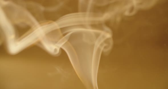 Abstract Wallpaper of White Smoke Steaming Up on Defocused Yellow Background Slow Motion. Vapor