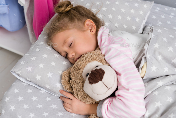 Baby sleeping sale with teddy bear