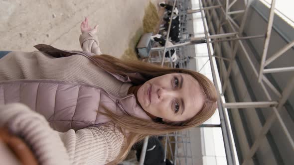 Vertical POV of Woman Filming Herself at Dairy Farm alt