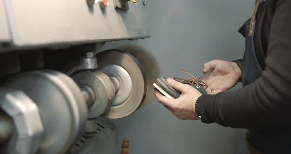 Craftsman Working with Shoes in a Workshop alt