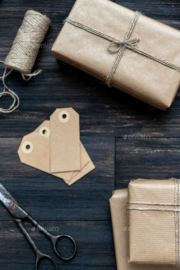 Handcraft christmas presents wrapped with recicled craft paper - Stock Photo - Images