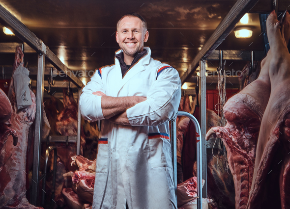 The butcher in a meat freezer storage.