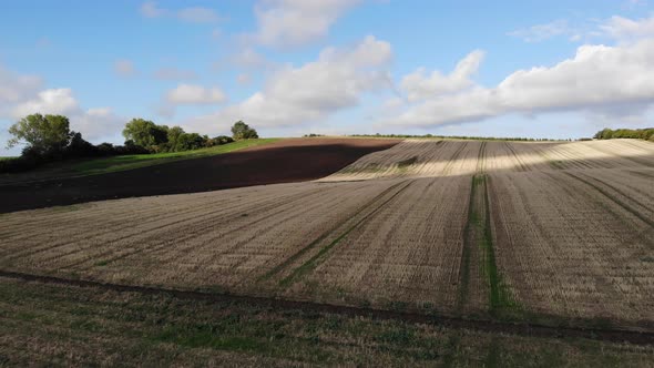 Aerial view of golden fields with brown mold close to Sejerøbugten in Odsherred. alt