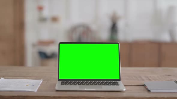 Rear View of Open Laptop with Green Chroma Screen alt