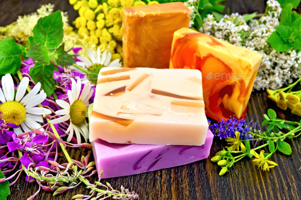 Soap homemade with flowers on board - Stock Photo - Images