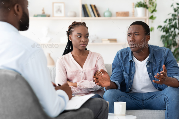 Emotional Black Man Talking To Family Counselor At Marital Therapy Session